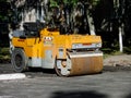 Yellow Asphalt Compactor or Road roller is ready to works for territory improvement.