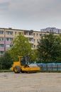 Yellow asphalt compactor