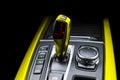 Yellow Automatic gear stick of a modern car. Modern car interior details. Close up view. Car detailing. Automatic transmission lev