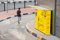 Yellow automatic parcel shipment station Noon Collect at city street. Electronic commerce business