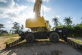 Yellow automobile crane with risen telescopic boom outdoors. Mobile construction crane on a constructin site. Crane Royalty Free Stock Photo