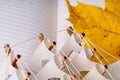 A yellow autumn leaf lies next to the pages of the diary and a small model ship. Royalty Free Stock Photo