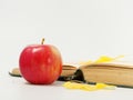 Yellow autumn leaves with red apples on a white background Royalty Free Stock Photo