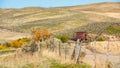 Yellow autumn trees and red rusted country barn