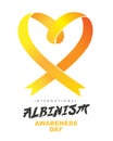 Yellow awareness ribbon in the shape of a heart. International Albinism Awareness Day. Genetic inherited condition Royalty Free Stock Photo