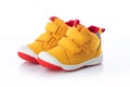 Yellow baby shoes. Kids sport sneakers isolated on white background Royalty Free Stock Photo