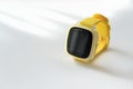 yellow baby smart watch with GPS tracking on white background. kids safety and communication.mobile safety watch with