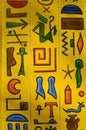 Yellow background with ancient Egyptian drawings