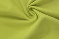 Yellow background of fabric from a piece of crumpled clothes