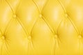 Yellow background pattern of a chesterfield leather sofa Royalty Free Stock Photo