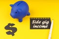 On a yellow background there is a piggy bank, a dollar symbol and paper with the inscription - Side gig income Royalty Free Stock Photo