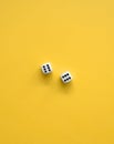 Yellow Background With White-Black Dices. Royalty Free Stock Photo