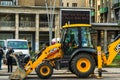 Yellow backhoe loader on construction site ready for working in Bucharest, Romania, 2020