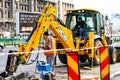 Yellow backhoe loader on construction site ready for working in Bucharest, Romania, 2020