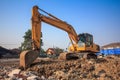 yellow backhoe loader on construction site and work Royalty Free Stock Photo