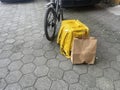 yellow backpack near the bike on the sidewalk. delivery concept Royalty Free Stock Photo