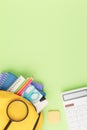 Yellow backpack with notebooks and study supplies. Royalty Free Stock Photo