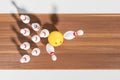 Yellow ball hitting pins on wooden bowling alley