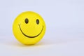 Yellow ball smiley on white background Royalty Free Stock Photo