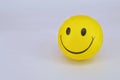 Yellow ball smiley on white background Royalty Free Stock Photo
