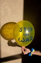 Yellow balloon with blue inscription stop the war. Solidarity with Ukraine