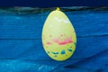 Yellow balloon on blue plastic background Royalty Free Stock Photo