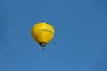 Yellow balloon in blue sky in Schodnica, Ukraine