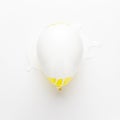 Yellow balloon painted white Royalty Free Stock Photo