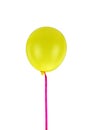 Yellow balloon and ribbon flying isolated on white background Royalty Free Stock Photo