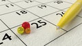 Yellow ballpen on a paper calendar closeup Royalty Free Stock Photo