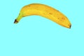 Yellow banana shape on light blue background. Banana Minimal. Pastel colors style. Popart. Digitalart. Surreal. Pop