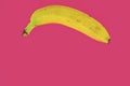 Yellow banana shape on pink background. Banana Minimal. Pastel colors style. Popart. Digitalart. Surreal. Pop. Creative