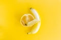 Yellow banana is wrapped around a grapefruit, the concept of forbidden interracial love Royalty Free Stock Photo