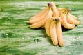 Yellow bananas on a green chalkboard