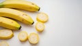 yellow bananas and sliced fruit. The background is white, which emphasizes the freshness and brightness of the fruits Royalty Free Stock Photo