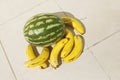 Yellow bananas and watermelon on the floor Royalty Free Stock Photo