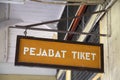 Yellow banner with ticketing office word hang on the wall of train station in Kluang
