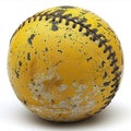 A yellow baseball sits serenely on a white background, contrasting with its vibrant color.