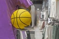 yellow basketball in the hands of a mannequin in shop Royalty Free Stock Photo