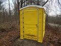 Yellow bathroom or restroom outdoor with trees