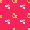 Yellow Battery icon isolated seamless pattern on red background. Lightning bolt symbol. Vector