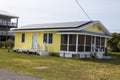 A yellow beach house located at Kure Beach and the Atlantic Ocean Royalty Free Stock Photo