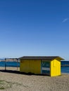Yellow beach hut on deserted beach Royalty Free Stock Photo