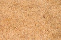 Yellow beach sand closeup for background. Tropical beach photo.