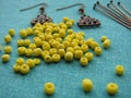 Yellow beads and other pieces for making earrings, handmade jewelry, super macro mode