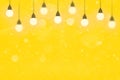 yellow beautiful shiny glitter lights defocused bokeh abstract background with light bulbs and falling snow flakes fly, festal Royalty Free Stock Photo