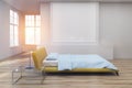 Yellow bed, wooden floor side toned Royalty Free Stock Photo