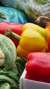Yellow Bell Pepper and Red Bell Peppers on Display Royalty Free Stock Photo