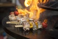 Yellow bell peppers, tomatoes and chili pepper are cooked on a hot grill surface Royalty Free Stock Photo