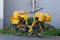 Yellow bicycle of a postman.